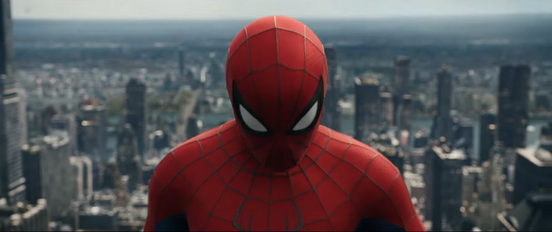 Spider-Man facing the camera with New York in the background